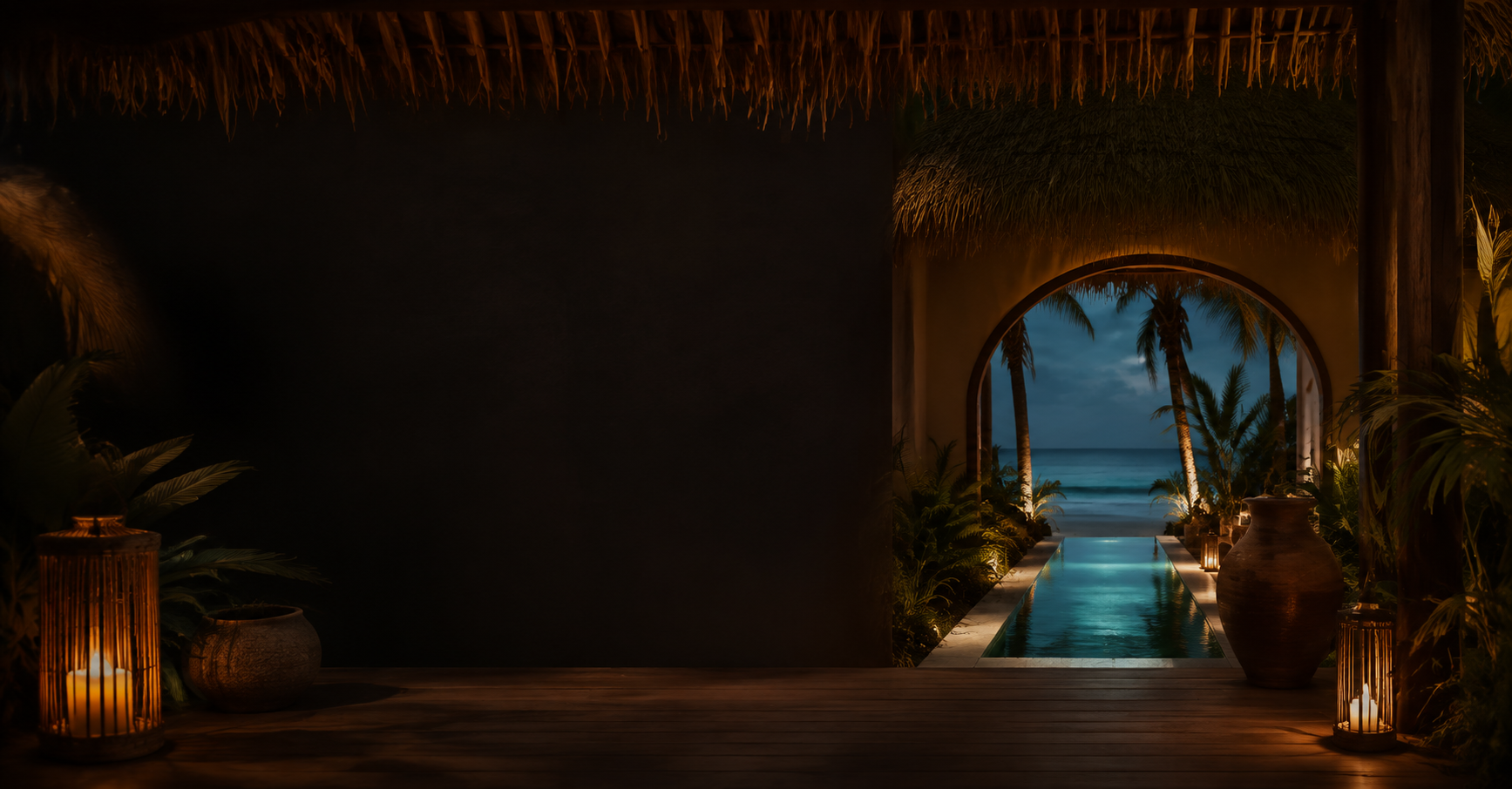Villa terrace at dusk with a glowing pool and thatched palapa roof